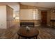 Open concept living space features wood paneling, modern flooring, and great natural light at 11596 W Sierra Dawn Blvd # 182, Surprise, AZ 85378