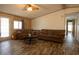 Inviting living room featuring wood-look flooring, cozy couches and plenty of natural light at 11596 W Sierra Dawn Blvd # 182, Surprise, AZ 85378