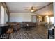 Spacious living room featuring a comfortable seating, wood-look floors and natural light at 11596 W Sierra Dawn Blvd # 182, Surprise, AZ 85378