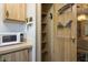 Efficient pantry with ample shelving and storage space, ensuring a tidy and organized kitchen at 11596 W Sierra Dawn Blvd # 182, Surprise, AZ 85378