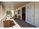 Cozy screened porch with seating, perfect for relaxing and enjoying the outdoors in comfort and style at 11596 W Sierra Dawn Blvd # 182, Surprise, AZ 85378