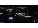 Night aerial view of a residential community featuring illuminated homes and neighborhood streets at 1217 E Monte Way, Phoenix, AZ 85042
