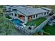 Aerial shot of a modern backyard with a pool, spa, artificial grass and an open patio at 1217 E Monte Way, Phoenix, AZ 85042