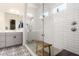 This bathroom features a tiled walk-in shower with a window and a gray double sink vanity at 1217 E Monte Way, Phoenix, AZ 85042