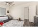 This bedroom features a modern geometric rug, a ceiling fan, and ample natural light at 1217 E Monte Way, Phoenix, AZ 85042