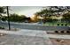 Community entrance with lush landscaping and architectural details, set against a scenic sunset at 1217 E Monte Way, Phoenix, AZ 85042