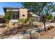 Contemporary home with a well-manicured xeriscaped front yard, modern design, and two-car garage at 1217 E Monte Way, Phoenix, AZ 85042