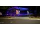 Front exterior view of a modern home with decorative purple lights at 1217 E Monte Way, Phoenix, AZ 85042