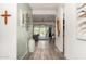 Inviting hallway with hardwood floors, neutral walls, and decorative wall art at 1217 E Monte Way, Phoenix, AZ 85042