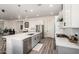 Bright kitchen with stainless steel appliances, island seating, and herringbone backsplash at 1217 E Monte Way, Phoenix, AZ 85042