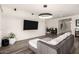 Bright living room with a large TV, comfortable sofa, and elegant decor at 1217 E Monte Way, Phoenix, AZ 85042