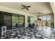 Large covered patio with geometric tiled flooring, comfortable seating and a view of the pool at 1217 E Monte Way, Phoenix, AZ 85042