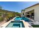 Backyard with a pool, spa, and patio, surrounded by desert landscaping and a view of the mountains at 1217 E Monte Way, Phoenix, AZ 85042