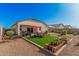 Wide view of the serene backyard, complete with a patio, artificial turf, and tasteful landscaping at 1284 W Sussex St, San Tan Valley, AZ 85143