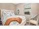 Bedroom with a colorful floral patterned bedspread, a window and a decorative print at 1284 W Sussex St, San Tan Valley, AZ 85143