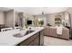 Open kitchen and living area seamlessly flow together, featuring modern appliances and a view to the backyard patio at 1284 W Sussex St, San Tan Valley, AZ 85143