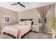 Serene main bedroom features a ceiling fan, cozy carpet, and soft natural light at 1284 W Sussex St, San Tan Valley, AZ 85143
