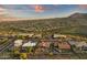 Picturesque aerial shot of a desert community with well-maintained homes and landscaping, set against rolling hills at 15600 E Robin Dr, Fountain Hills, AZ 85268
