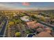 Tranquil aerial view of a desert community with a patio, desert landscaping, and pool at 15600 E Robin Dr, Fountain Hills, AZ 85268