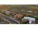 Scenic aerial view of a desert community and home with a red tile roof at 15600 E Robin Dr, Fountain Hills, AZ 85268