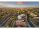 Sweeping aerial view of a desert neighborhood highlighting well-kept homes, landscaping, and scenic mountain views at 15600 E Robin Dr, Fountain Hills, AZ 85268