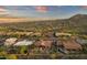 Expansive aerial view showcasing a desert community nestled among green landscaping and scenic mountain vistas at 15600 E Robin Dr, Fountain Hills, AZ 85268