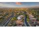 Aerial perspective showcasing a community with desert landscaping, neighborhood streets and distant city views at 15600 E Robin Dr, Fountain Hills, AZ 85268