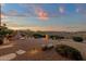 Expansive backyard featuring a built in barbecue, lush landscaping, and tranquil water feature at 15600 E Robin Dr, Fountain Hills, AZ 85268