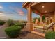 Outdoor patio with lounge seating, desert landscaping and covered structure at 15600 E Robin Dr, Fountain Hills, AZ 85268