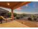 Relaxing backyard space with chaise lounge and desert landscaping at 15600 E Robin Dr, Fountain Hills, AZ 85268