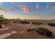 Expansive backyard featuring a built in barbecue, lush landscaping, and tranquil water feature at 15600 E Robin Dr, Fountain Hills, AZ 85268