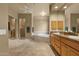 Large bathroom features double sinks, granite countertops, tub, walk-in shower, and tile flooring at 15600 E Robin Dr, Fountain Hills, AZ 85268