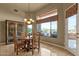 Dining area with a round table and large windows providing natural light and views at 15600 E Robin Dr, Fountain Hills, AZ 85268