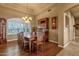 Dining room with hardwood floors, ornate china cabinet, and a beautiful chandelier over the dining table at 15600 E Robin Dr, Fountain Hills, AZ 85268
