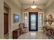 Elegant foyer with tile floors, a decorative front door, and classic furnishings for a sophisticated entry at 15600 E Robin Dr, Fountain Hills, AZ 85268