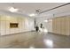 This spacious garage features overhead lighting, storage cabinets, and a door to the exterior at 15600 E Robin Dr, Fountain Hills, AZ 85268