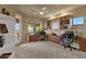 Spacious home office featuring built-in shelving, two desks, and views to the outdoors at 15600 E Robin Dr, Fountain Hills, AZ 85268