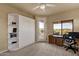 Home office with built-in shelving, a desk, a Murphy bed, and access to the patio at 15600 E Robin Dr, Fountain Hills, AZ 85268