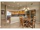 A bright and sunny kitchen area with wooden cabinetry, stainless steel appliances, and a cozy dining nook at 15600 E Robin Dr, Fountain Hills, AZ 85268