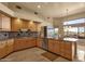 Well-lit kitchen featuring wooden cabinetry, stainless steel appliances, and granite countertops at 15600 E Robin Dr, Fountain Hills, AZ 85268
