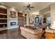 Bright living room with a fireplace, hardwood floors, and elegant furniture arrangement at 15600 E Robin Dr, Fountain Hills, AZ 85268