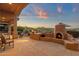 Covered patio boasting an outdoor kitchen, fireplace, and views at 15600 E Robin Dr, Fountain Hills, AZ 85268