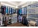 Spacious walk-in closet features plenty of storage, custom shelving and hardwood flooring at 15600 E Robin Dr, Fountain Hills, AZ 85268
