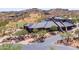 Community clubhouse aerial showing meticulous landscaping, golf course views, and architectural design at 16134 E Ridgestone Dr, Fountain Hills, AZ 85268