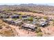 Aerial view of desert community showcasing modern architecture, lush desert landscaping, and neighborhood street at 16134 E Ridgestone Dr, Fountain Hills, AZ 85268