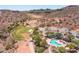 Desert community aerial featuring golf course, community pool, drought-resistant landscaping, and parking at 16134 E Ridgestone Dr, Fountain Hills, AZ 85268