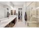 This bathroom boasts a glass shower, double sinks, and modern finishes at 16134 E Ridgestone Dr, Fountain Hills, AZ 85268