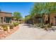 Modern home with sleek design, desert landscaping, a glass garage door, and a stone accent wall for an upscale look at 16134 E Ridgestone Dr, Fountain Hills, AZ 85268