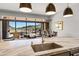 Gourmet kitchen with island sink and outdoor view to the patio and grill, perfect for entertaining at 16134 E Ridgestone Dr, Fountain Hills, AZ 85268