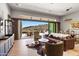 Open floor plan living room with hardwood floors and sliding glass doors to the patio at 16134 E Ridgestone Dr, Fountain Hills, AZ 85268